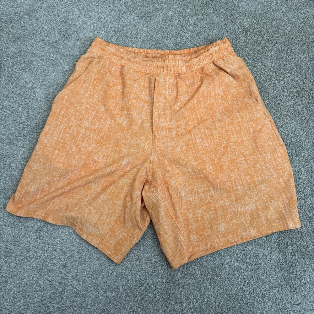 Orange Lululemon pacebreaker lined shorts. Men’s small 7’’